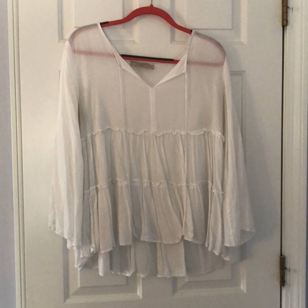 White ruffled blouse